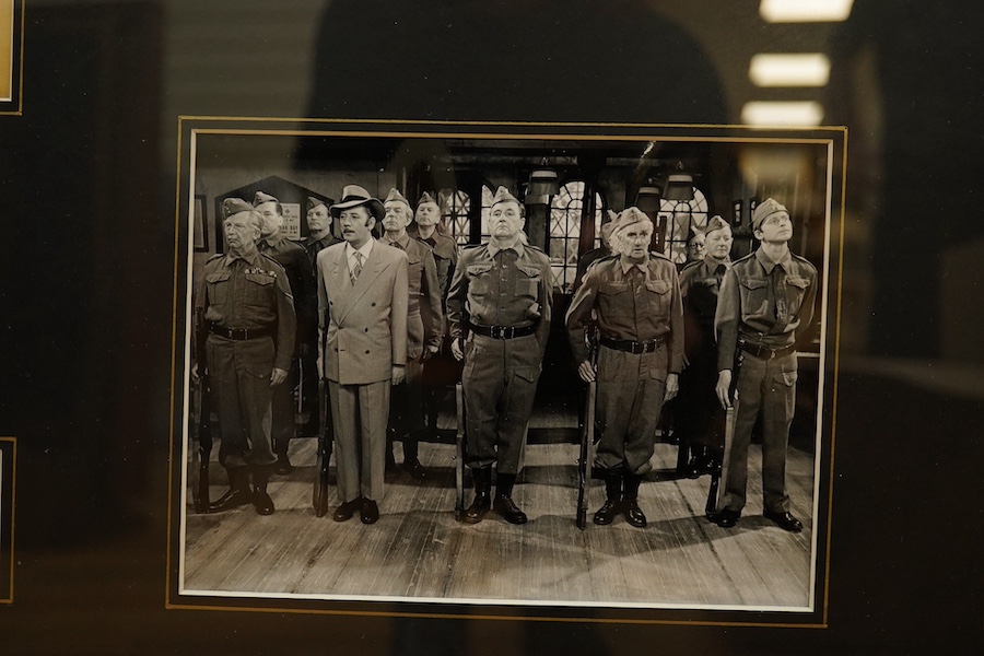 A framed and mounted display of ten autographs from the cast of Dad's Army, together with two photographs, signatures include